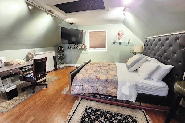 Queens size bed
Hanging Smart TV 
Desk and Chair