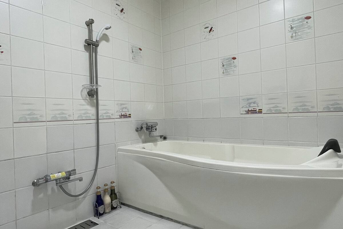 bathtub, deep-soaking bathtub, hair dryer, bathrobes