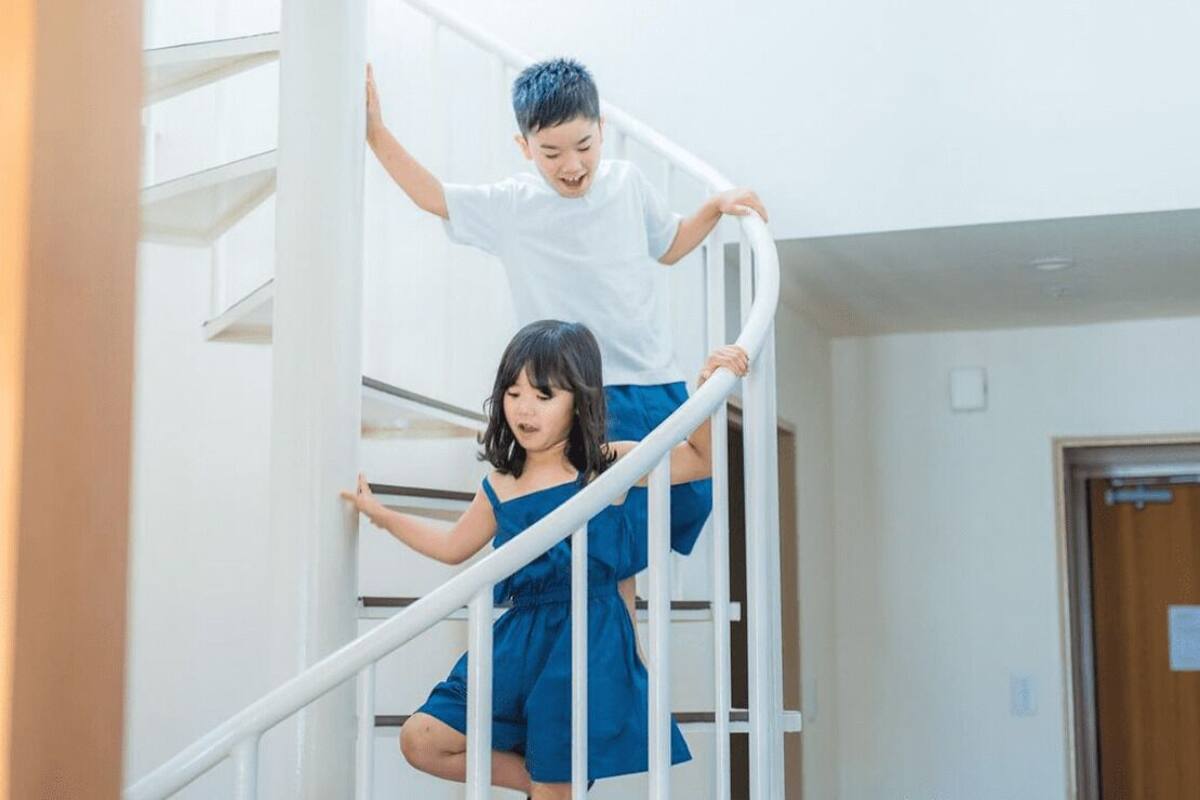 A staircase with a white railing.