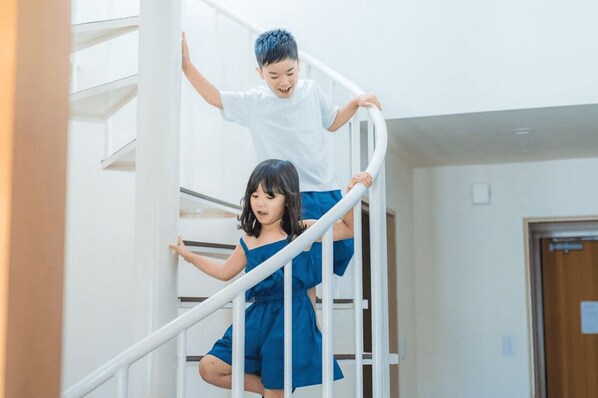 Individually decorated, desk, laptop workspace, soundproofing - Rycom Family Resort Hotel (Okinawa)
