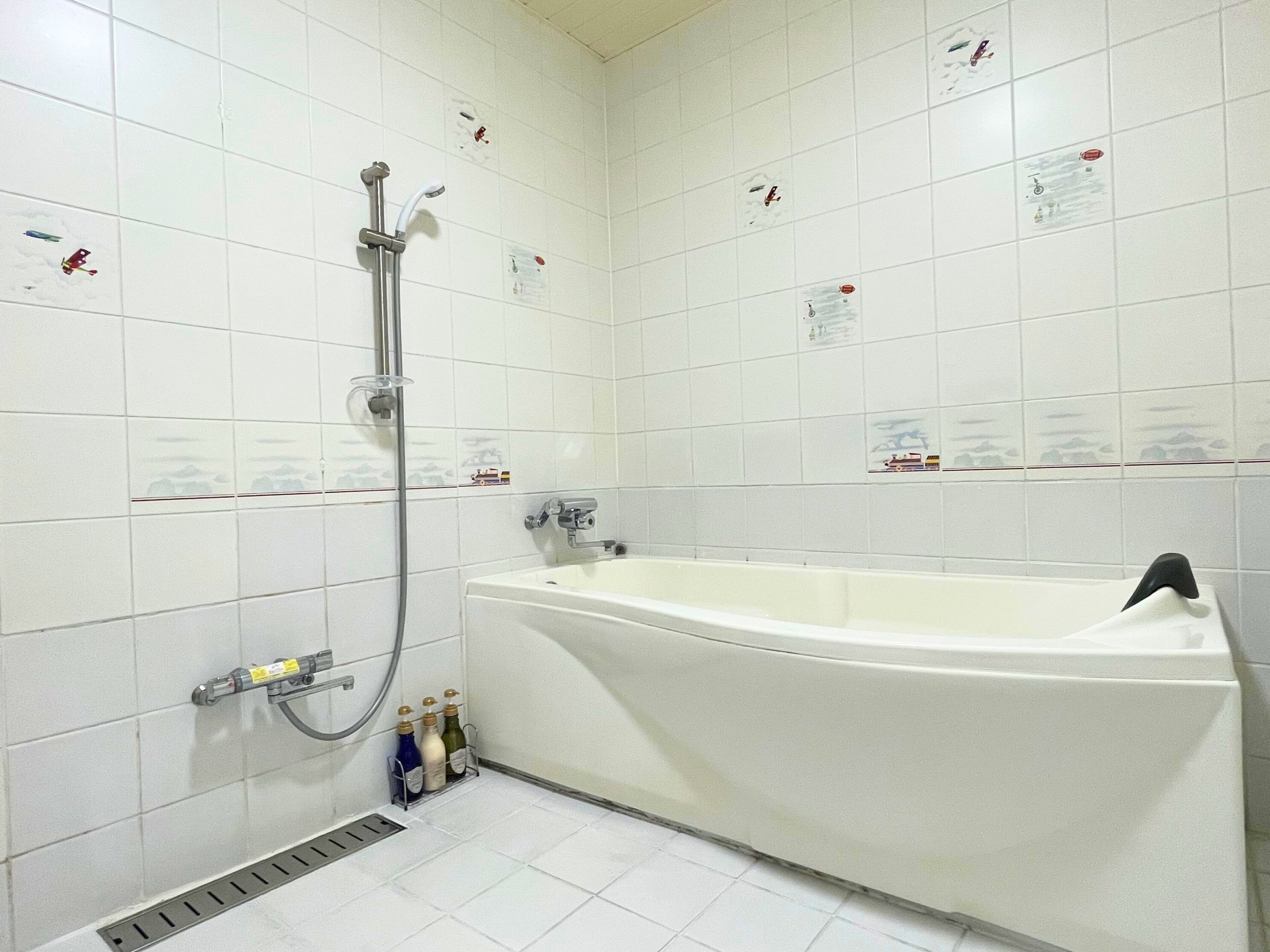 bathtub, deep-soaking bathtub, hair dryer, bathrobes