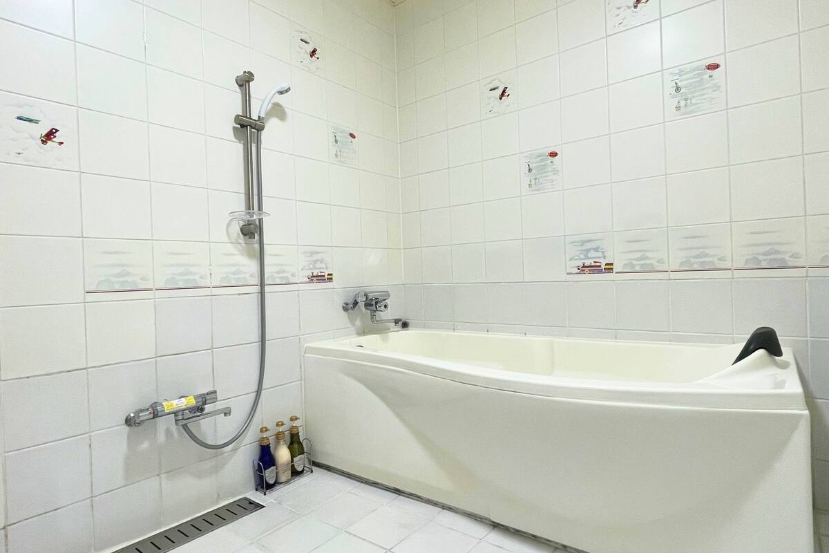 bathtub, deep-soaking bathtub, hair dryer, bathrobes