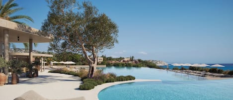2 outdoor pools, pool umbrellas, pool loungers