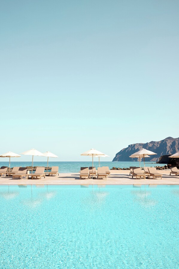 2 outdoor pools, pool umbrellas, pool loungers