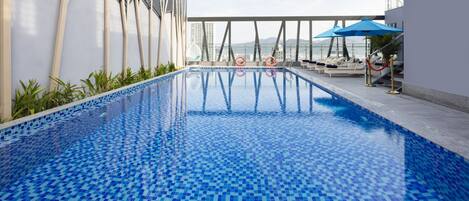 Outdoor pool, pool umbrellas, sun loungers