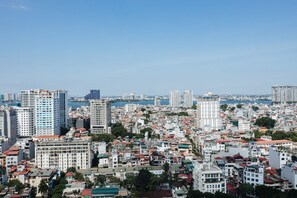 A cityscape with high-rise buildings and a dense urban area. - Shendo Vinhomes Metropolis (Hanoi)