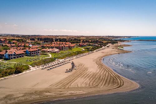 On the beach, sun-loungers, beach umbrellas, beach towels