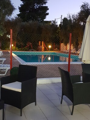 Seasonal outdoor pool, open 10:30 AM to 7:00 PM, pool umbrellas