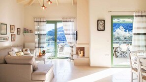 Villa (Daphne) | Living area | LED TV, fireplace, DVD player