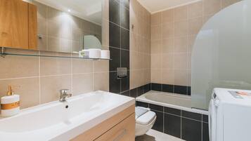 Apartment, 2 Bedrooms | Bathroom | Combined shower/tub, deep soaking tub, hair dryer, towels