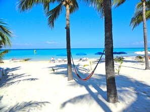 On the beach, sun loungers, beach towels