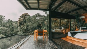 A modern bedroom with a large bed, a wooden desk, and a seating area. - Bio Habitat Hotel, AKEN SOUL Collection (Circasia)