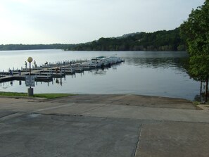 Stroll along the waterfront dock, surrounded by lush greenery and calm waters.