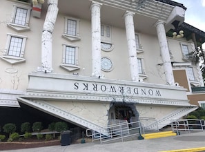 A building facade with the name 'NANDERMOORS' prominently displayed, featuring classical columns, large windows, and a central clock. - Cedar Lodge 405 (Pigeon Forge)
