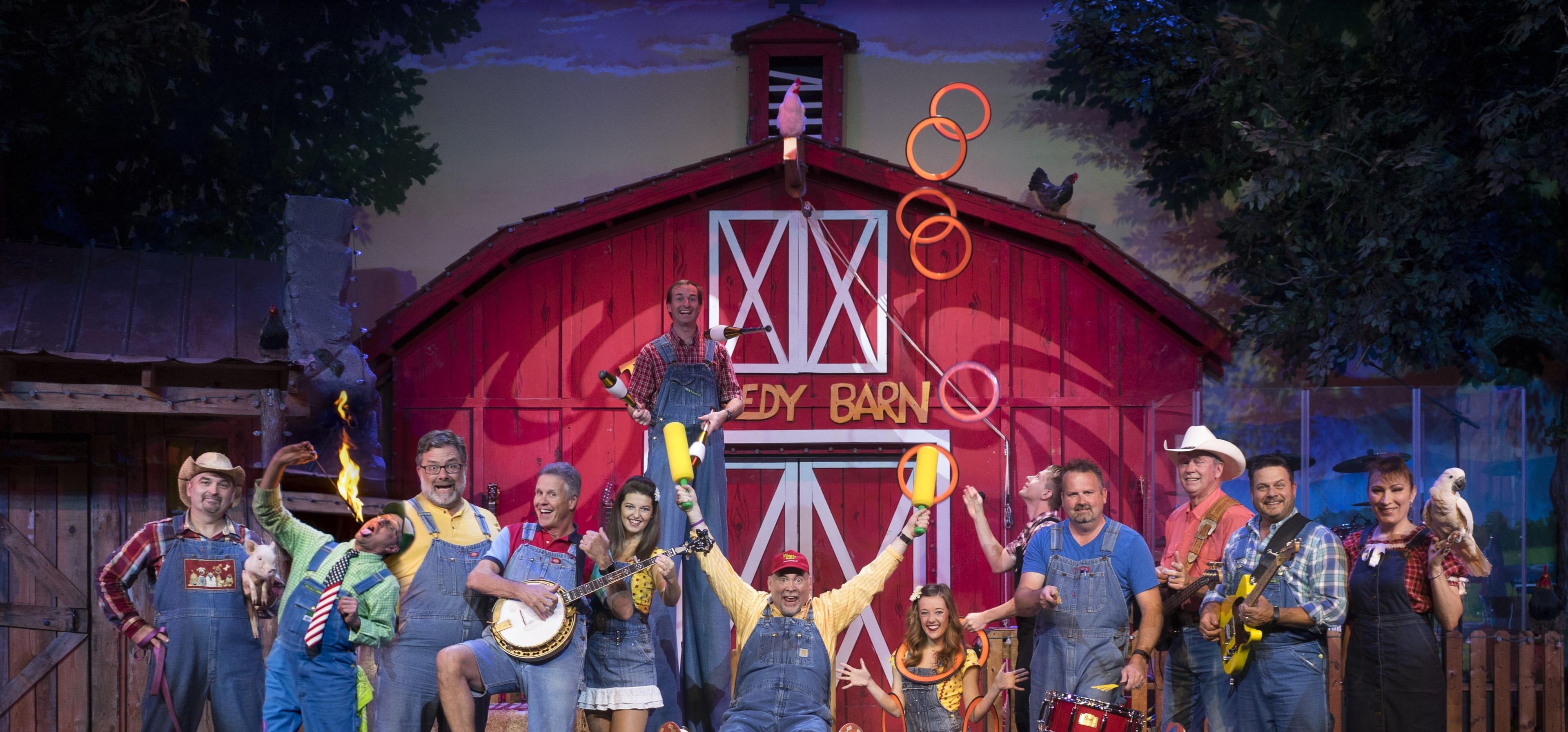 A group of people in front of a red barn with a sign that reads "EDDY BARN."
