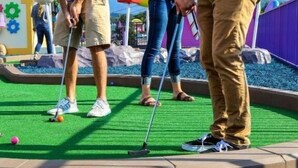 A miniature golf course with artificial turf and a putting green. - Whispering Pines 441 (Pigeon Forge)