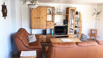 Apartamento (Fe 3 Springfloot) | Área de estar | TV de tela plana, DVD player