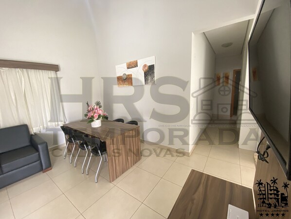 Deluxe Apartment, 3 Bedrooms, Garden View | Living room | 28-inch LCD TV with satellite channels, TV