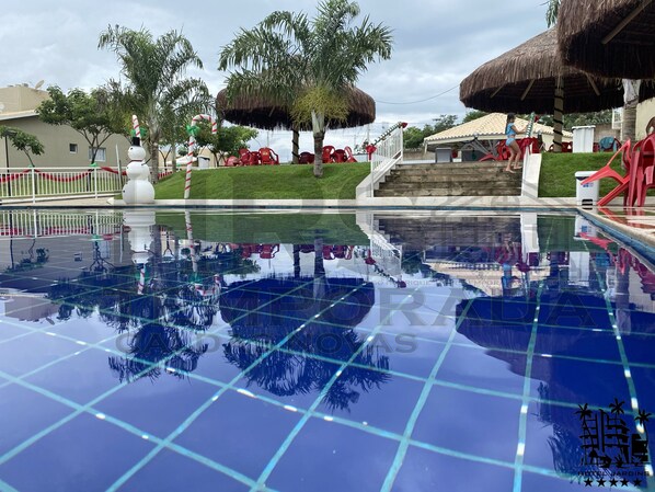 5 outdoor pools, open 9:00 AM to 11:00 PM, pool umbrellas, sun loungers