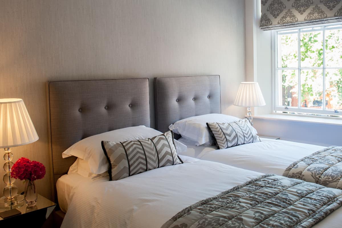 Townhouse Two Bedroom One Bathroom Apartment | Premium bedding, in-room safe, individually decorated