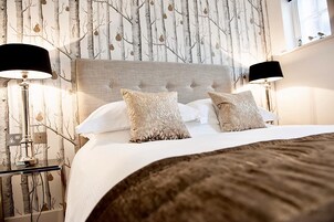 Deluxe One-Bedroom Apartment | Premium bedding, in-room safe, individually decorated