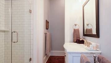 Deluxe Room, 1 King Bed | Bathroom | Designer toiletries, hair dryer, bathrobes, towels