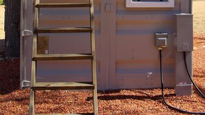 A portable structure with a ladder, a window, and electrical outlets. - Cliffside Tiny Home Container  #5 (Orderville)