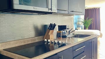 Fridge, microwave, stovetop, coffee/tea maker