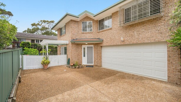A two-story house with a garage, a covered patio, and a fenced backyard. - 3/54 Owen Street, Port Macquarie (Port Macquarie)