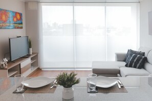 Departamento, 1 habitación | Área de sala de estar | Smart TV