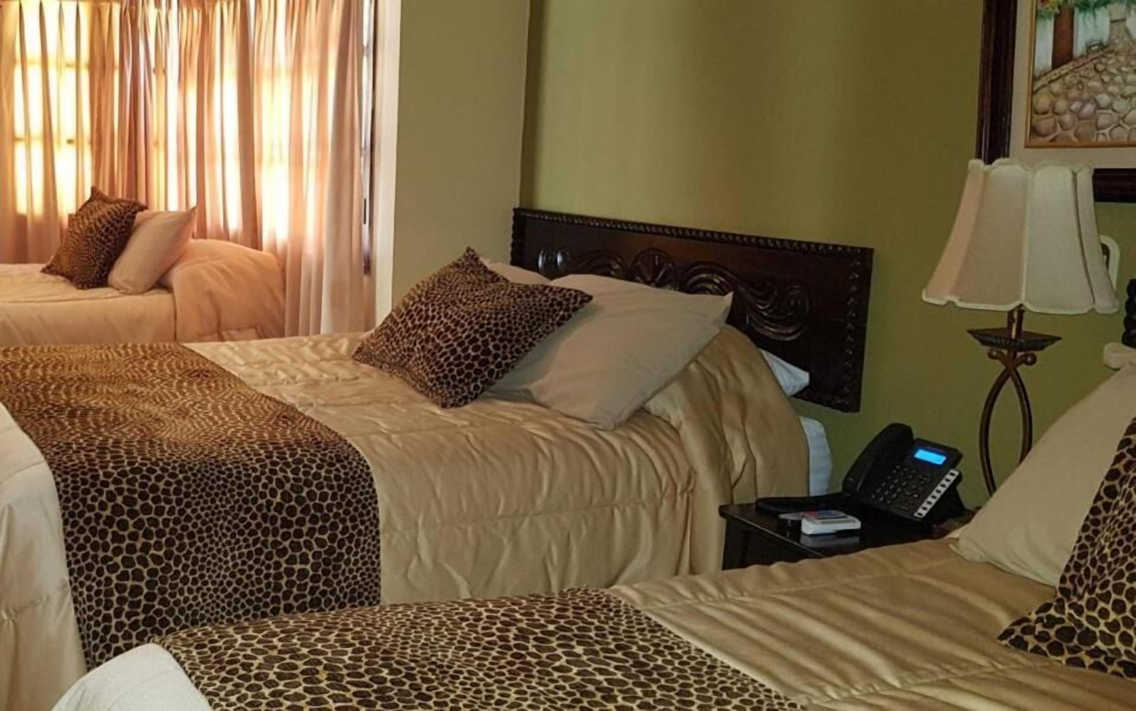 desk, blackout curtains, iron/ironing board, cots/infant beds