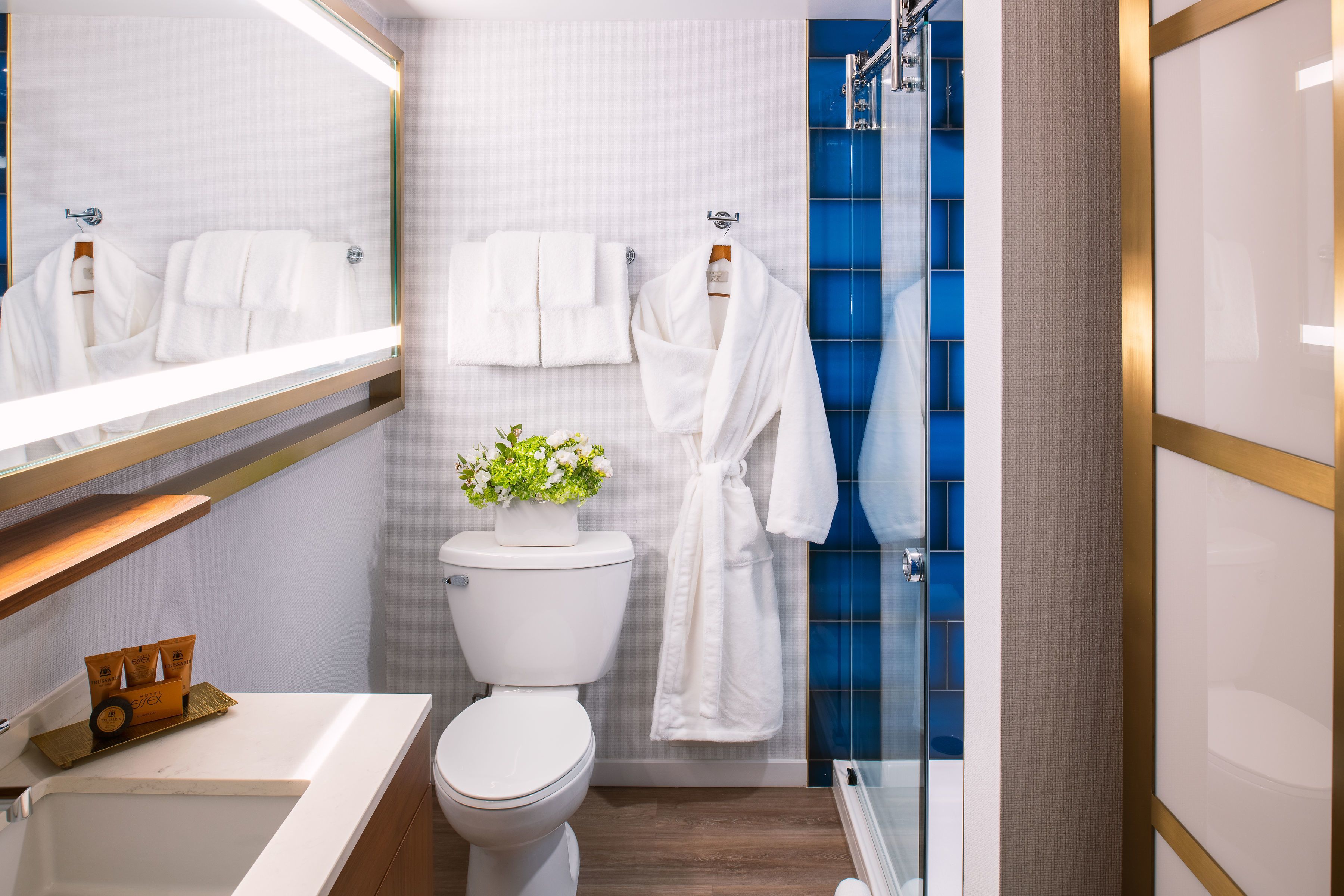 rainfall showerhead, hair dryer, bathrobes, towels