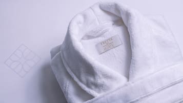 A white towel with a label reading "Frette elix."