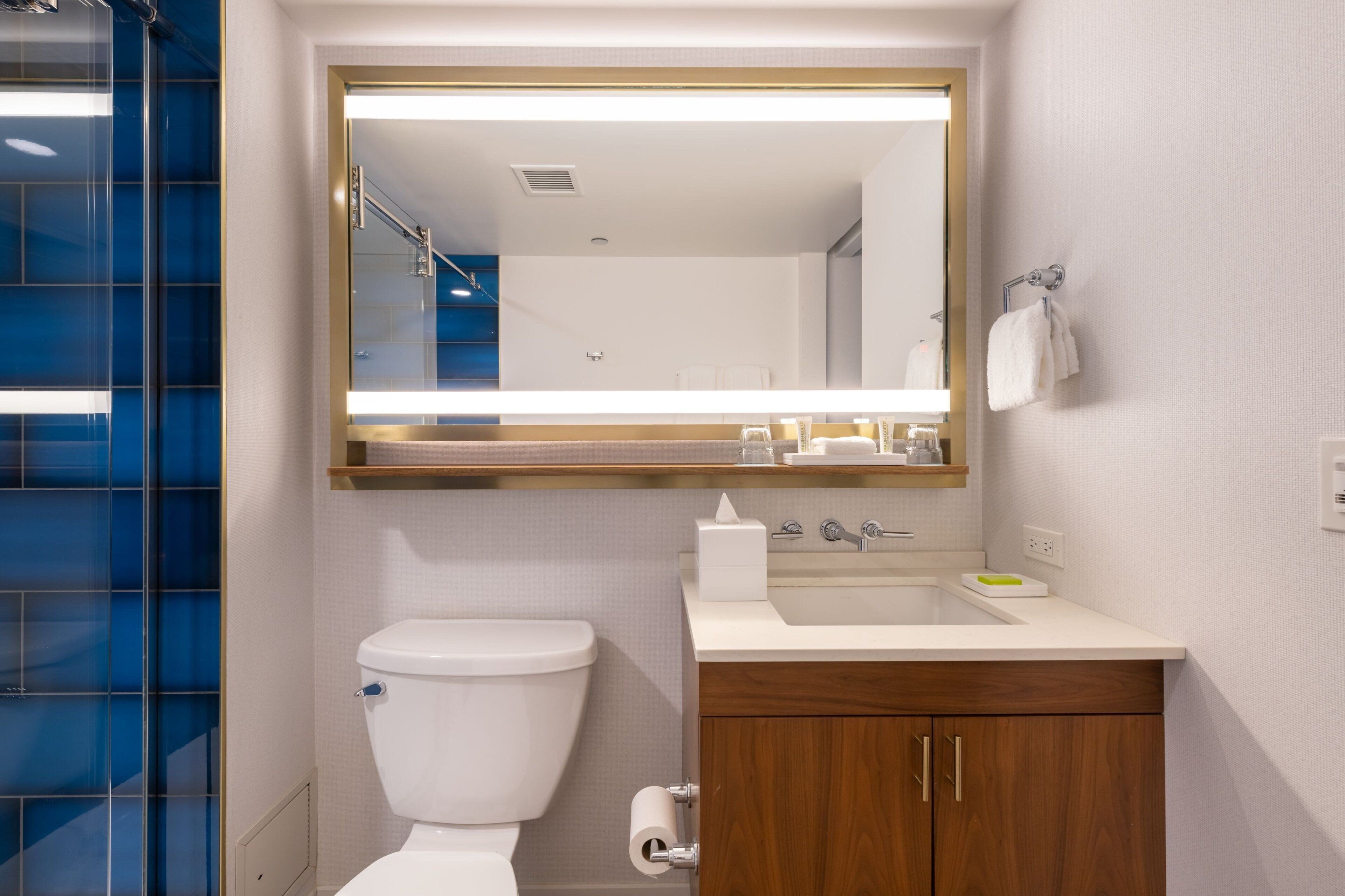 rainfall showerhead, hair dryer, bathrobes, towels