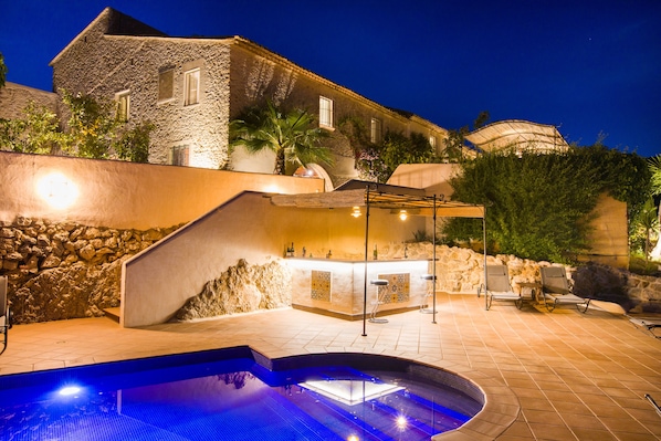 Outdoor pool, a heated pool, sun loungers