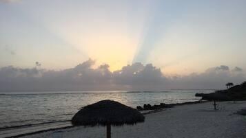 On the beach, sun loungers, beach umbrellas, beach towels
