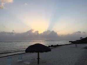 On the beach, sun-loungers, beach umbrellas, beach towels