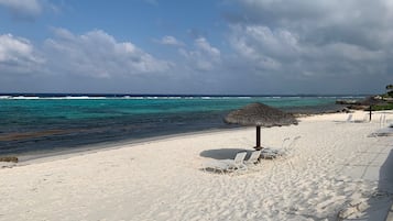 On the beach, sun loungers, beach umbrellas, beach towels