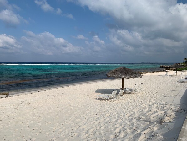 On the beach, sun-loungers, beach umbrellas, beach towels