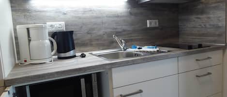Fridge, microwave, coffee/tea maker, toaster