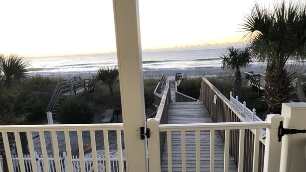 A wooden boardwalk leading to a beach with a view of the ocean. - EXTREME OCEANFRONT -  Heated Pool & Hot Tub / Linens & Gas grill inc. discounted (Surfside Beach)