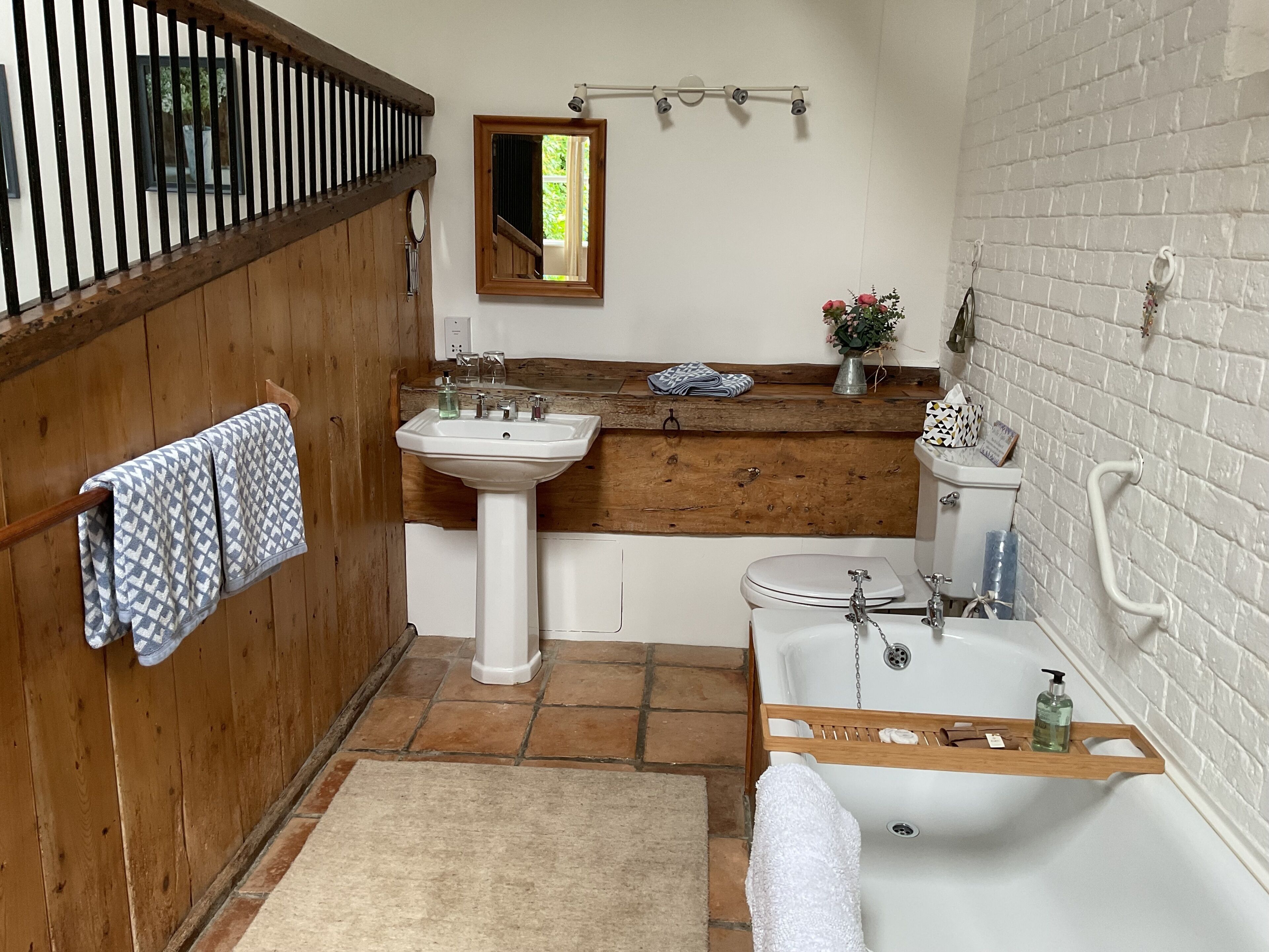 Bathtub, hair dryer, towels, soap