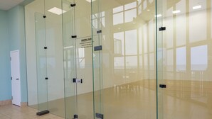 A hallway with glass walls and a sign indicating 'RAOULTAL RULES'. - Wonderful Location! Clean Unit with Gorgeous Gulf Front Views! Family Friendly! (Orange Beach)