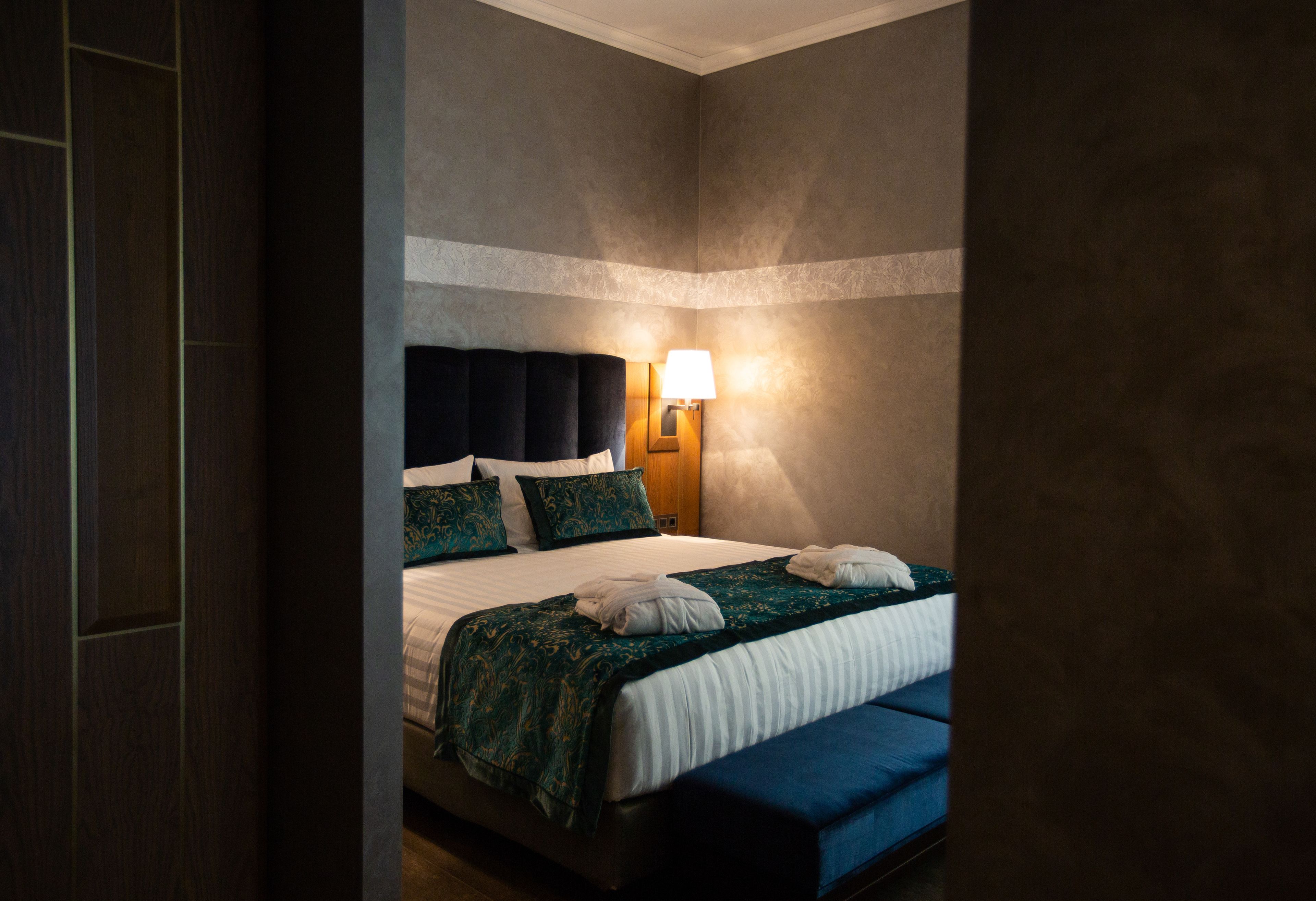 deluxe suite, 2 bedrooms, shared bathroom, partial sea view | 1 bedroom, minibar, in-room safe, desk