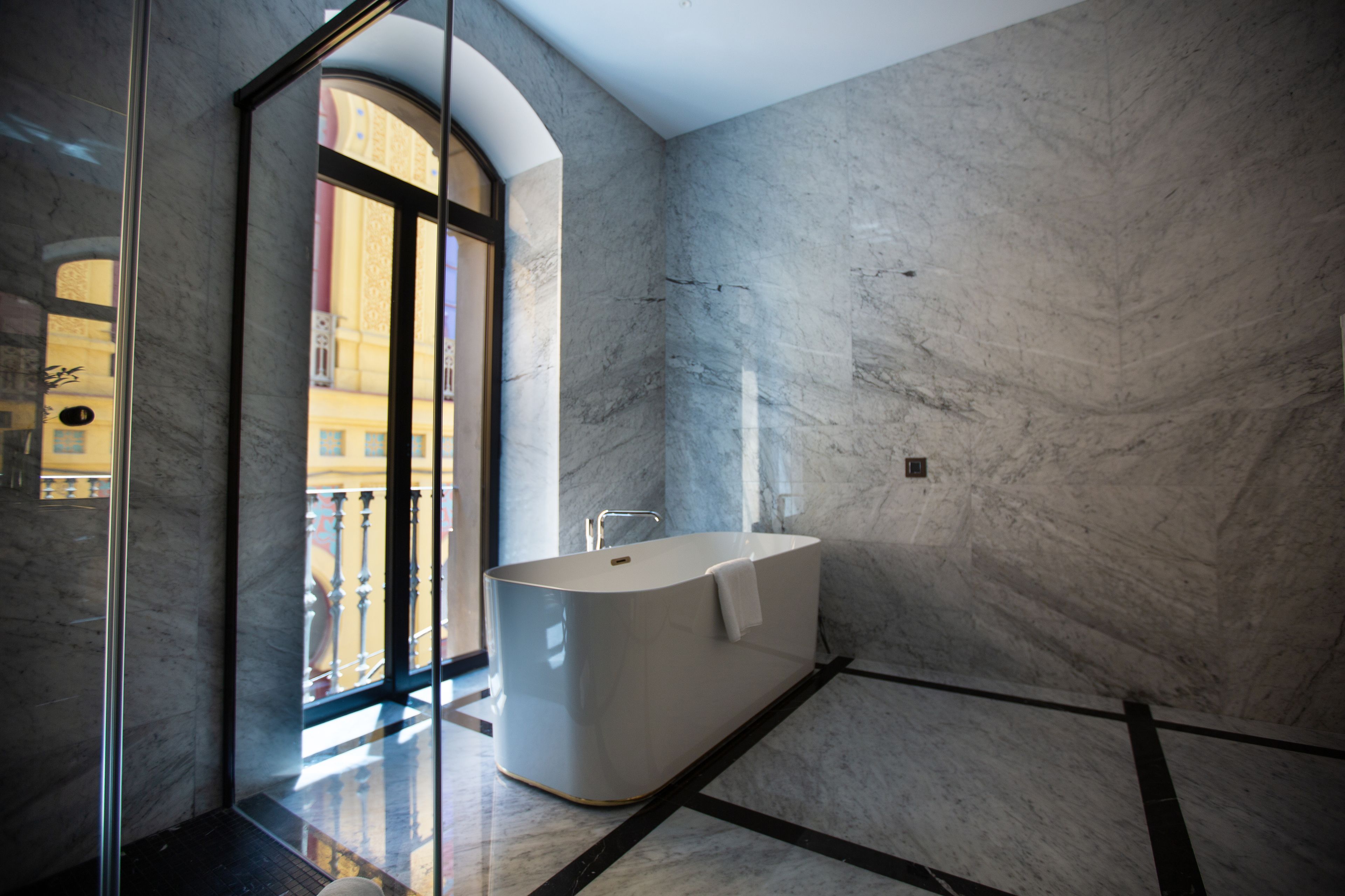 deluxe suite, 2 bedrooms, shared bathroom, partial sea view | bathroom | shower, rainfall showerhead, designer toiletries, hair dryer