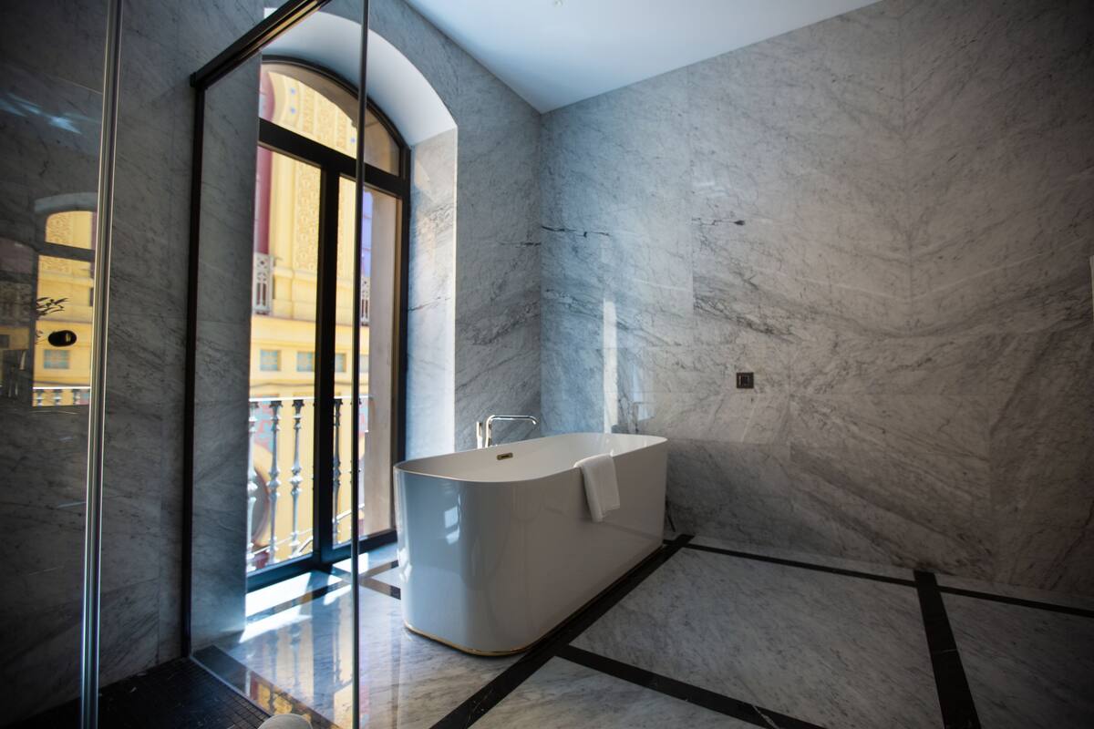 deluxe suite, 2 bedrooms, shared bathroom, partial sea view | bathroom | shower, rainfall showerhead, designer toiletries, hair dryer