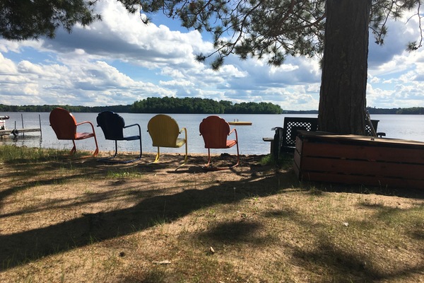 Vintage beach chairs and view of the resort swimming area.