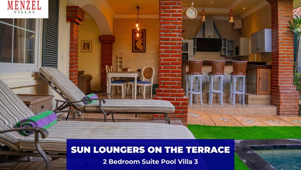A 2-bedroom suite with a pool, sun loungers on the terrace, and a kitchen area. - Menzel Villa (Nusa Dua)