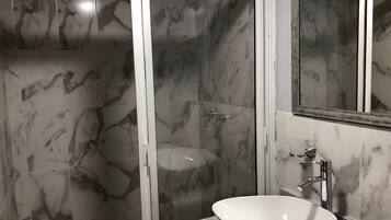 Shower, towels, soap, toilet paper