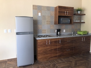Fridge, microwave, stovetop, coffee/tea maker
